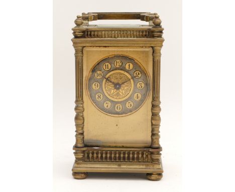 Early 20th century French brass carriage clock, having pierced gilt dial silvered chapter ring with Arabic numerals, housing 