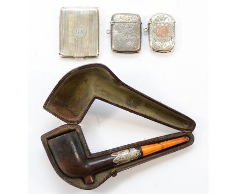 Two silver vesta cases, a silver match holder and a silver mounted pipe