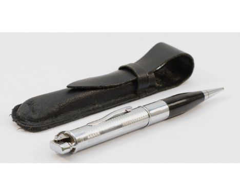 A Ronson Art Metal Works 'Pencilighter' circa 1930s, chrome plated with engine turned decoration, propelling pencil with blac