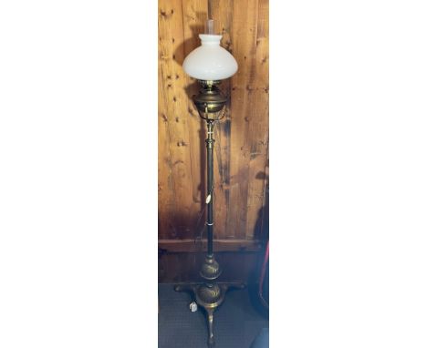 An early twentieth century telescopic brass floor standing lamp, later converted to electric, H-63cm.