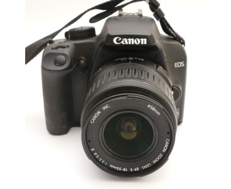 A Canon EOS 1000D digital camera with a Canon EF-S f/3.5-5.6 18-55mm lens, in original box.