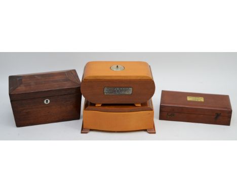 A walnut tea caddy, complete with two lidded compartments, together with a cased Sikes hydrometer, and two music boxes, one w