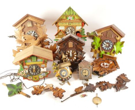 A collection of six mid-twentieth century Black Forest cuckoo clocks, having single and twin train manual wind movement, suit