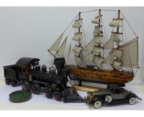 A model Mayflower tall masted ship, model locomotive, model car and compass