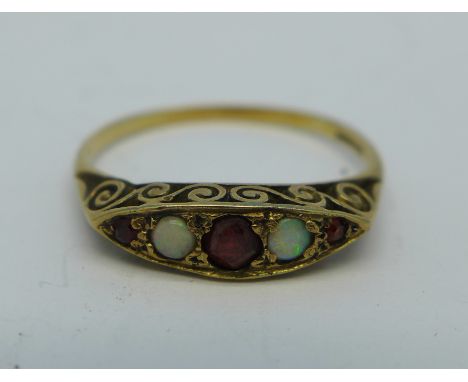 A 9ct gold, garnet and opal ring, 1.6g, Q