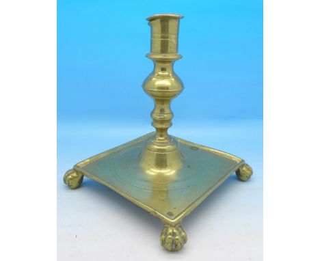 An early brass candlestick, possibly 18th Century, 16cm