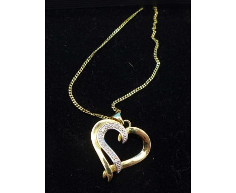 A silver gilt and diamond heart pendant and chain