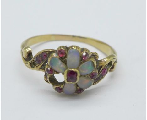 A Victorian opal and ruby ring, 1.7g, L, lacking three stones