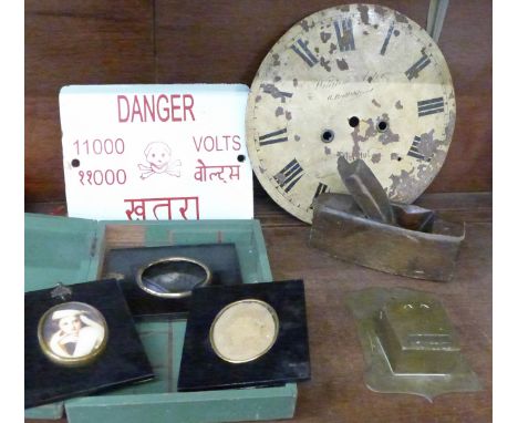 A long case clock dial, enamel sign, three ebonised frames, a wood plane and a wall mounted match holder