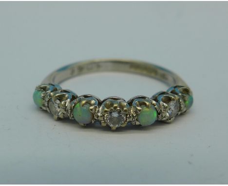 An 18ct gold, opal and diamond ring, 2.7g, N