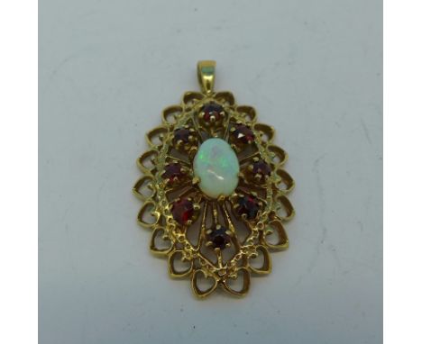 A 9ct gold, opal and red stone pendant, 3.2g