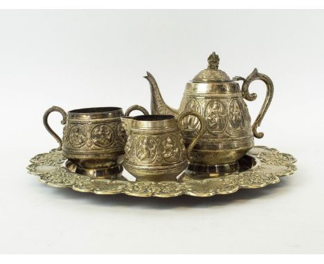 TEA SERVICE, white metal eastern comprising teapot, sugar bowl and milk jug, plus a silver plated tray, white metal weight: 7