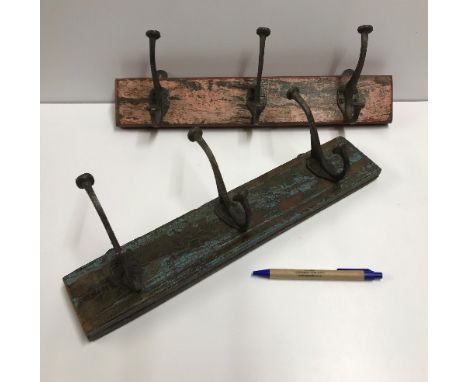 Two three hook coat hooks set on vintage style wooden blocks, 40 cm long