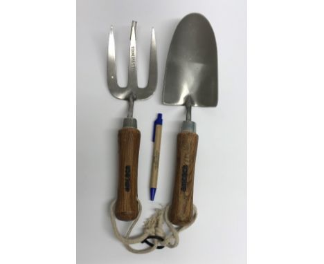 An Amtech wooden handled trowel and fork set