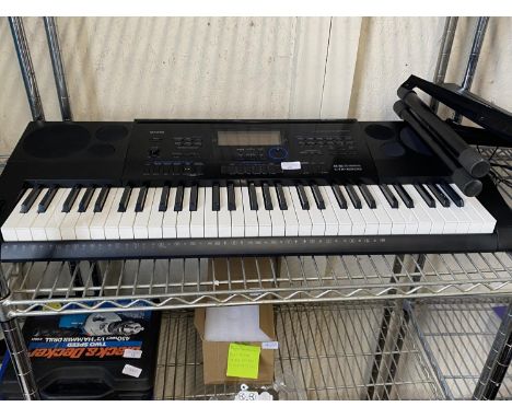 A Casio CTK-6200 electronic keyboard with stand, shipping unavailable 