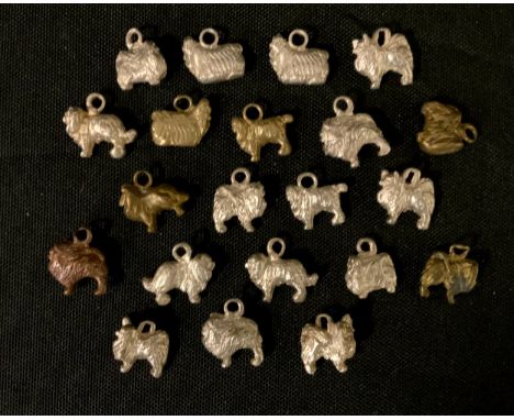 Twenty one silver, bronze and other coloured metal miniature model dogs, assorted breeds, mostly Terrier, Spaniels, sizes fro