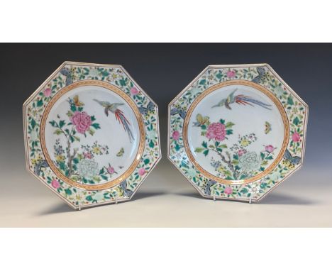 A pair of Chinese octagonal dishes, painted in polychrome enamels with phoenix, chrysanthemums, blossoming prunus and insects