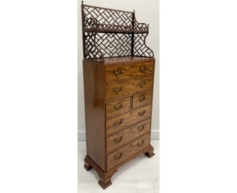 A Chippendale design mahogany secretaire library chest, the ‘cockpen’ superstructure with bookcase shelf pierced with a galle