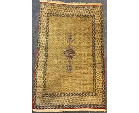 A Persian Qom, or Qum rug, early to mid 20th century, silk and wool mix, typical dense knotting in subdued tones of blue, red