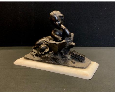 A contemporary bronze coloured metal figure, After the Antique as a cherub reading, alabaster plinth, 18cm high, 27cm wide 