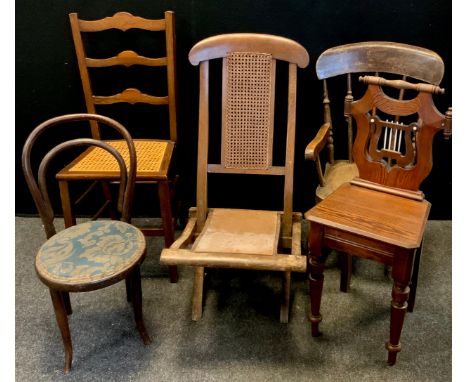 A late Victorian folding steamer chair, c.1890; a ladder back bedroom chair, c.1890; a bentwood chair in the manner of Thonet