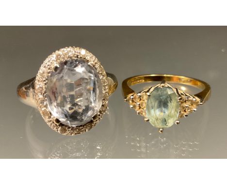 A pale blue topaz and diamond dress ring, 9ct gold shank, size M, 2.7g gross;  another paste, silver shank (2) 