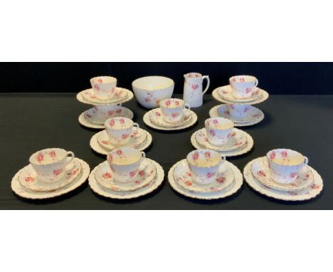 Aynsley tea service for ten, decorated with printed flowers comprised of; ten tea cups and saucers, ten side plates, milk jug