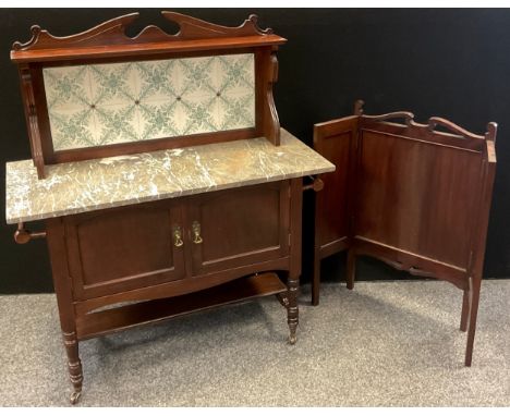 An Edwardian mahogany wash-stand, swan-neck pediment, tiled splash-back, the base having a Rosa-grey fossil stone marble top,