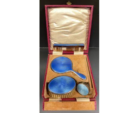 An Art Deco guilloche blue enamelled miniature vanity set, hand mirror, comb and brush, Levi &amp; Salaman, Birmingham 1927, 