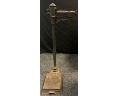 A set of Allen &amp; Hanbury of London Cast Iron Platform Scales, gilt detailing, slide balance scale, 0-24 stone, 134cm high