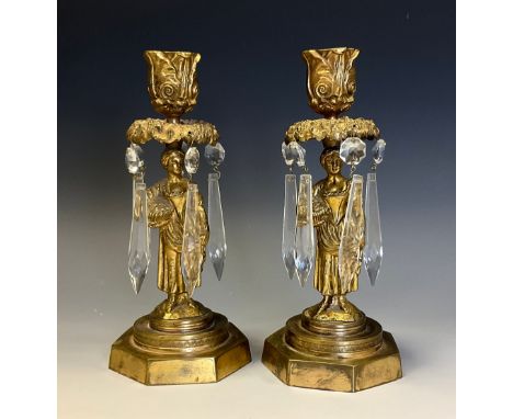 A pair of 19th century gilt bronze figural candle lustres, each cast as a pastoral beauty gathering flowers, octagonal bases,