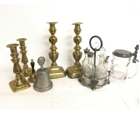 Bronze candlesticks, bells, and a Benetfink & Co silver plated cruet set and tankard