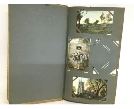 An album of vintage postcards including landscapes, portraits including some victorian etc