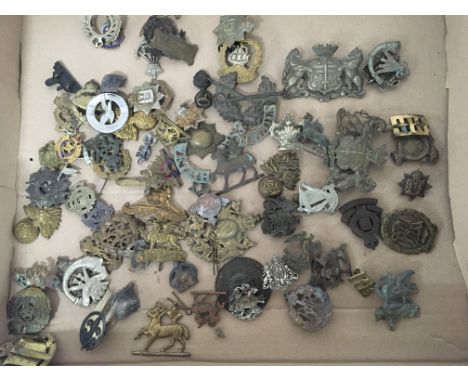 A good collection of genuine First and Second World War British Military regimental hat badges including I world war Tank Reg