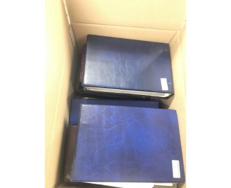 A box containing a large collection of albums of first day covers and stamps