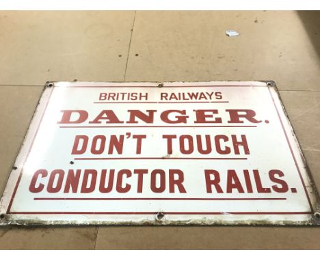 A vintage enamelled British Railways sign, danger don't touch conductor rails. Dimensions 50x32cm approximately. Postage cate