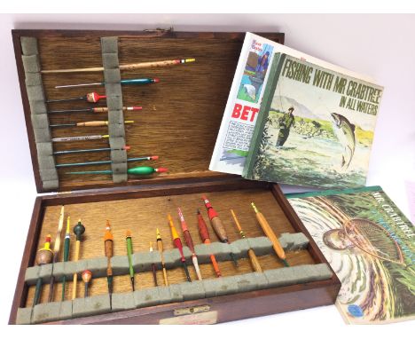 A vintage Box of fishing floats and some books. Postage category c.