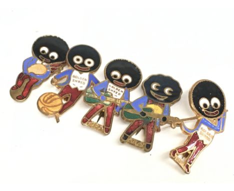 Five vintage enamel Rev Gomm Golden Shred golly badges. Postage category A Notice from the the-saleroom.com: These items are 