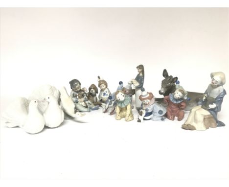 A Collection of Lladro and Nao figures including clowns and animals. No obvious damage or restoration. This lot cannot be pos