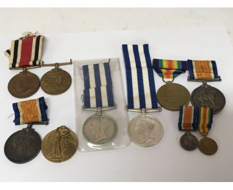 A collection of medals Two Victorian Egypt 1882 medals one with no inscription the other with worn inscription. Two First Wor