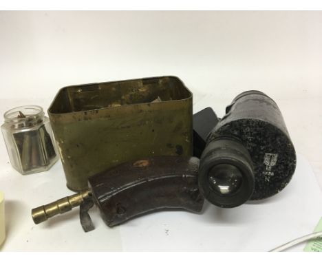 A German monocular gun scope a collection of inert shell cases and other military oddments.