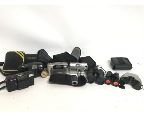 A Collection of various binoculars and digital cameras including Canon Snappy LX, Minolta AF50 Big finder, Olympus supertrip.