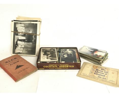 A collection of vintage postcards, cigarette cards, stamps, photographs. Postage category C