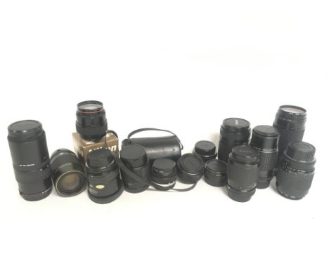 A collection of camera lenses including a Yashica AF 70-210mm 1:4.5, Nikon AF Nikkor 70-210mm, Nikon 50-250mm 1:4-5.6 etc. Th