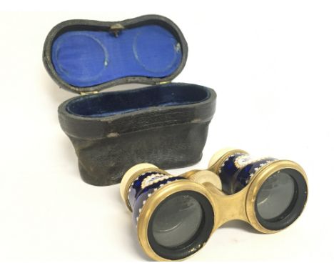 A cased pair of enamel opera glasses. This lot cannot be posted