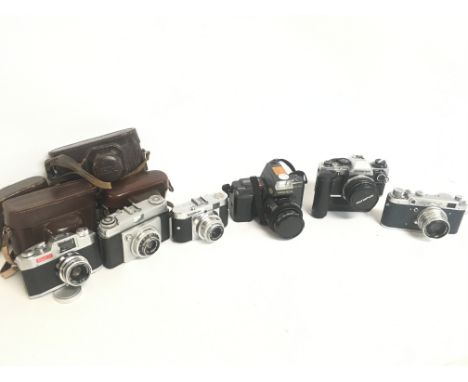 Vintage cameras including a VoigtlÃ¤nder Vito B, Dial JR, Yashica Kyocera, FED-2, Ilford Sportsman