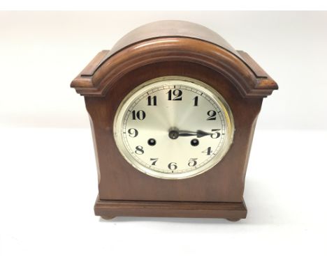A mahogany mantle clock in need of repair. 28cm by 23cm