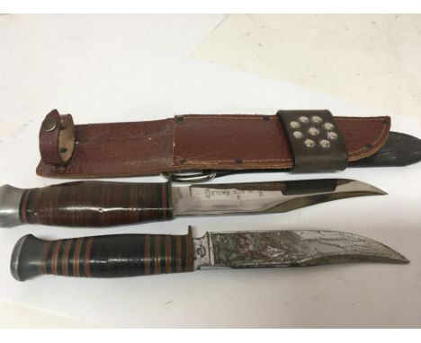 A Black Eagle British hunting knife Sheffield with leather scabbard and a scout knife with enamel decorated blade (2)