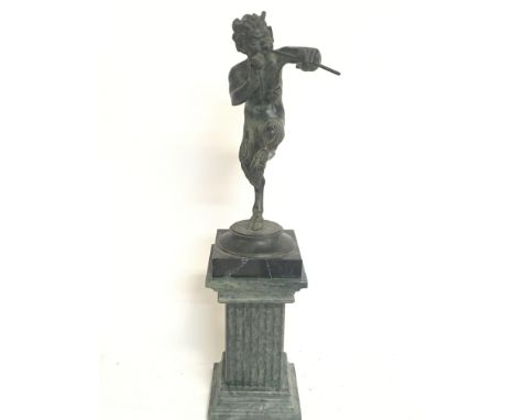 A bronze figure of Pan on a marble base, 42cm tall. This lot cannot be posted.