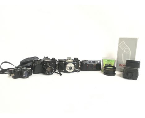 Vintage cameras and accessories including Pentax Auto 10, Topcon Unirex, Coronet 66, Yashica J2. This lot cannot be posted